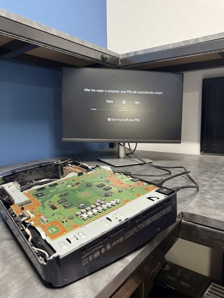 PS5 opened up on the bench for board-level repair at GadgetWorx Hesperia